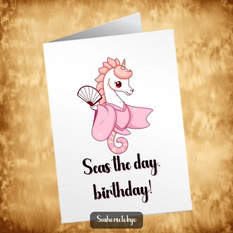 Free printable birthday card featuring a cute seahorse in a pink kimono, elegantly balancing a fan, adding a touch of class.