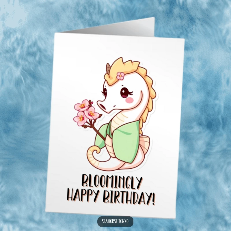 Funny Free Printable Birthday Card: Smiling seahorse in a green kimono, holding a delicate cherry blossom for a happy birthday.