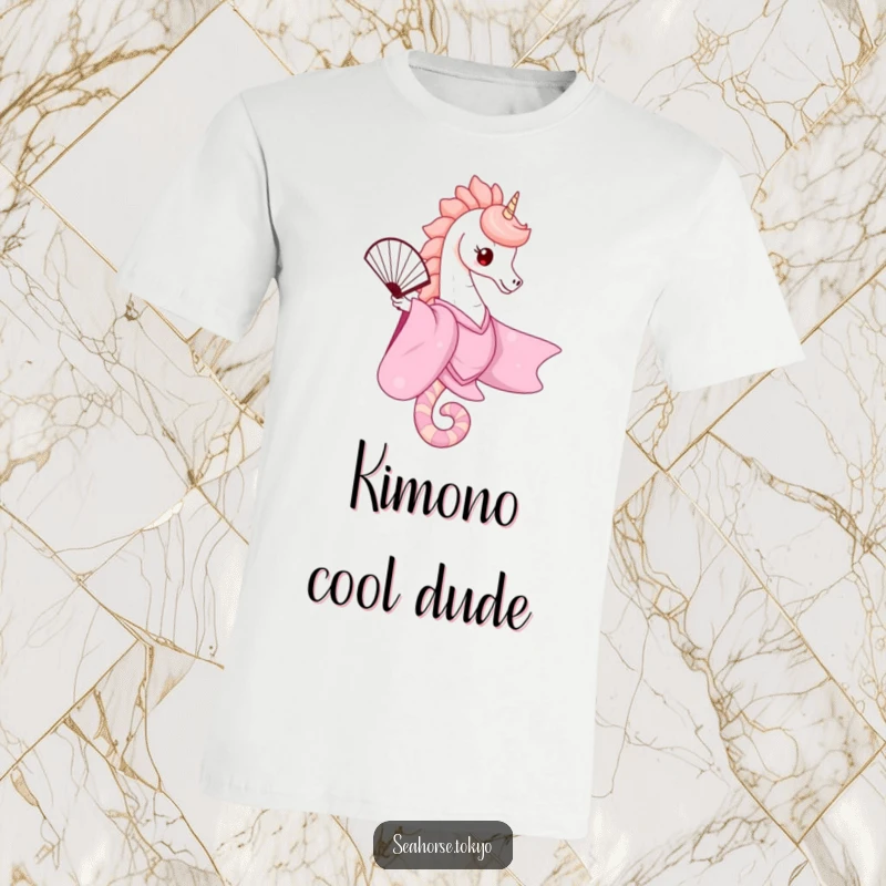 A cute seahorse wearing a flowing pink kimono, gracefully balancing a fan on a t-shirt, offering a whimsical and fashionable statement.