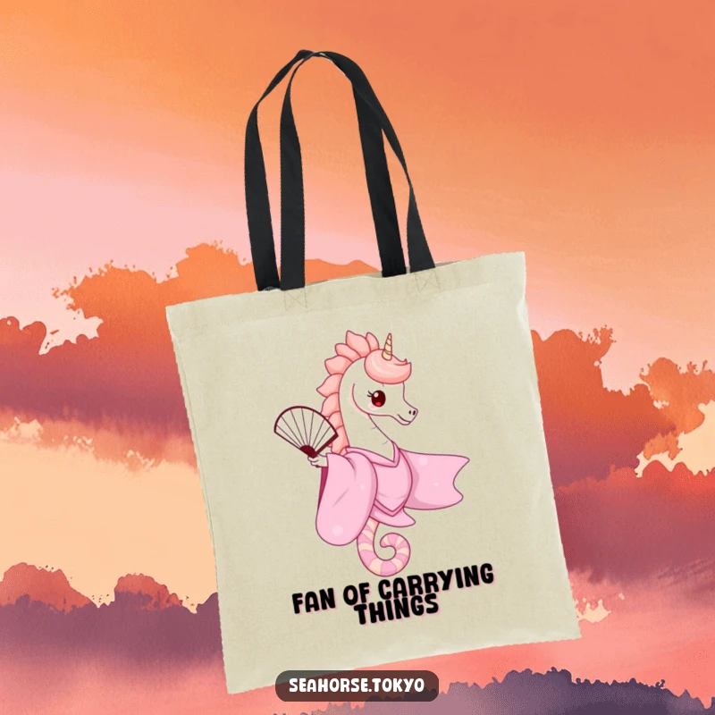 A stylish tote bag with a cute seahorse in a pink kimono gracefully balancing a fan, perfect for carrying essentials with a touch of elegance.